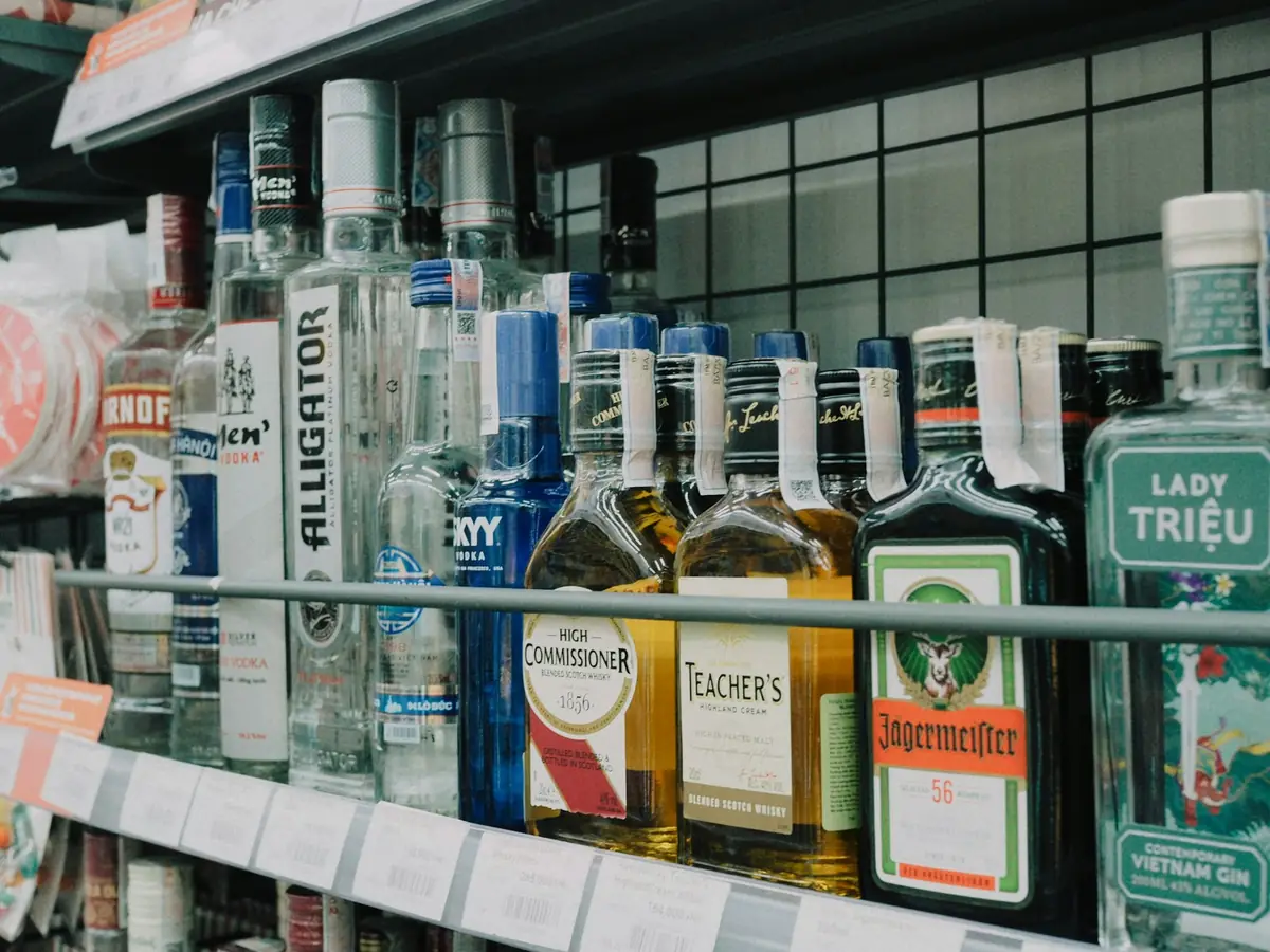 Bottles of spirits lined up on a store shelf